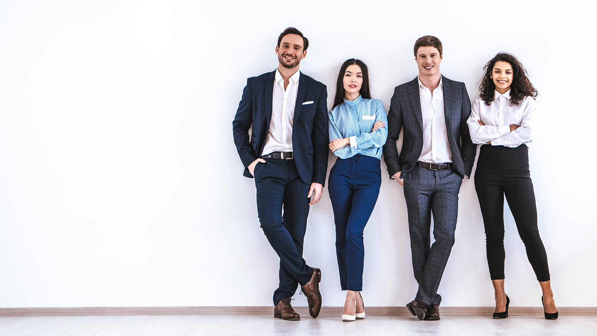 team of young professionals attired in smart business wear