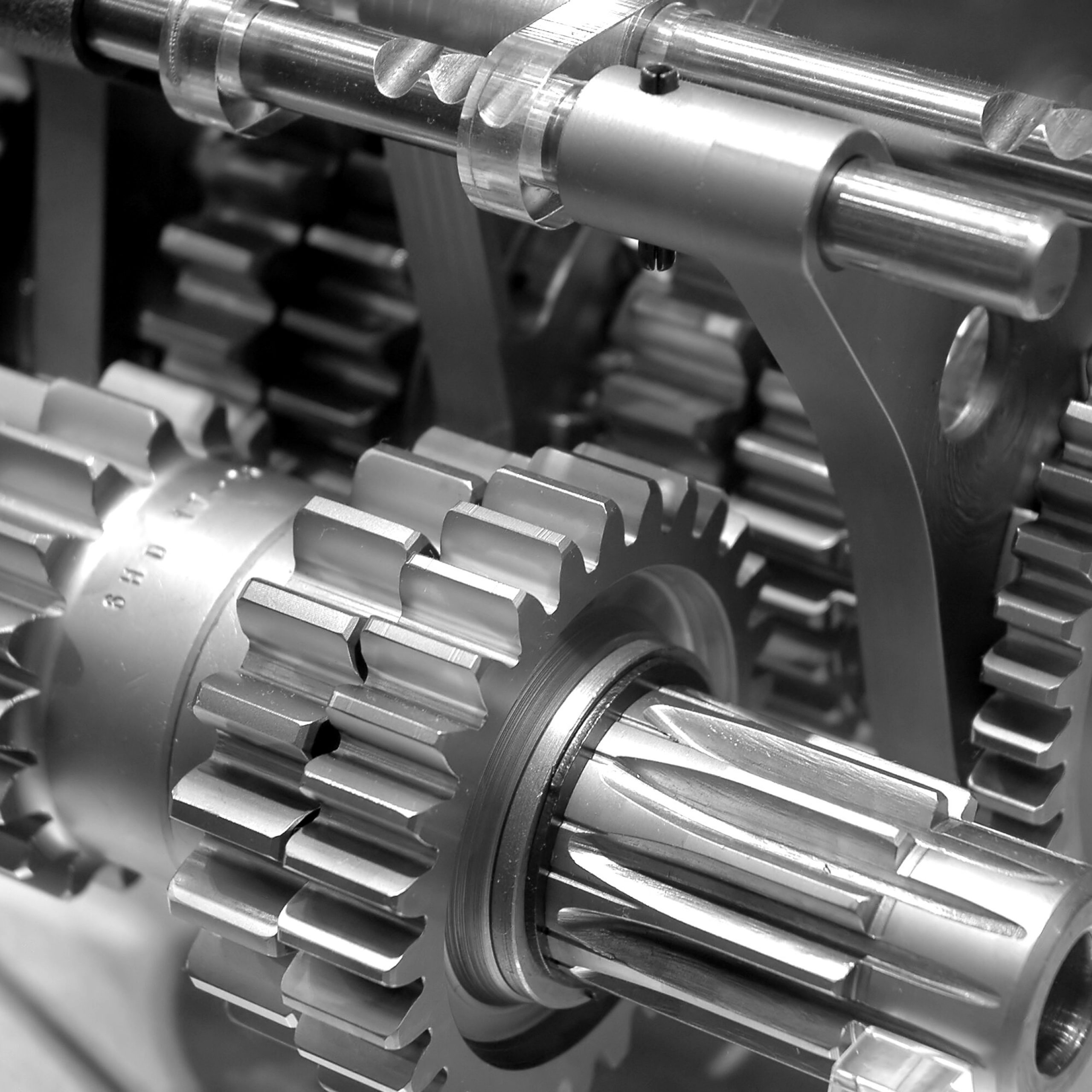 Partial view of gears in a machine in black and white